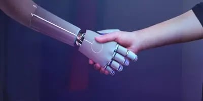 A handshake between a human and a robot.